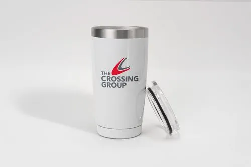 a drink tumbler with the crossing group logo on it