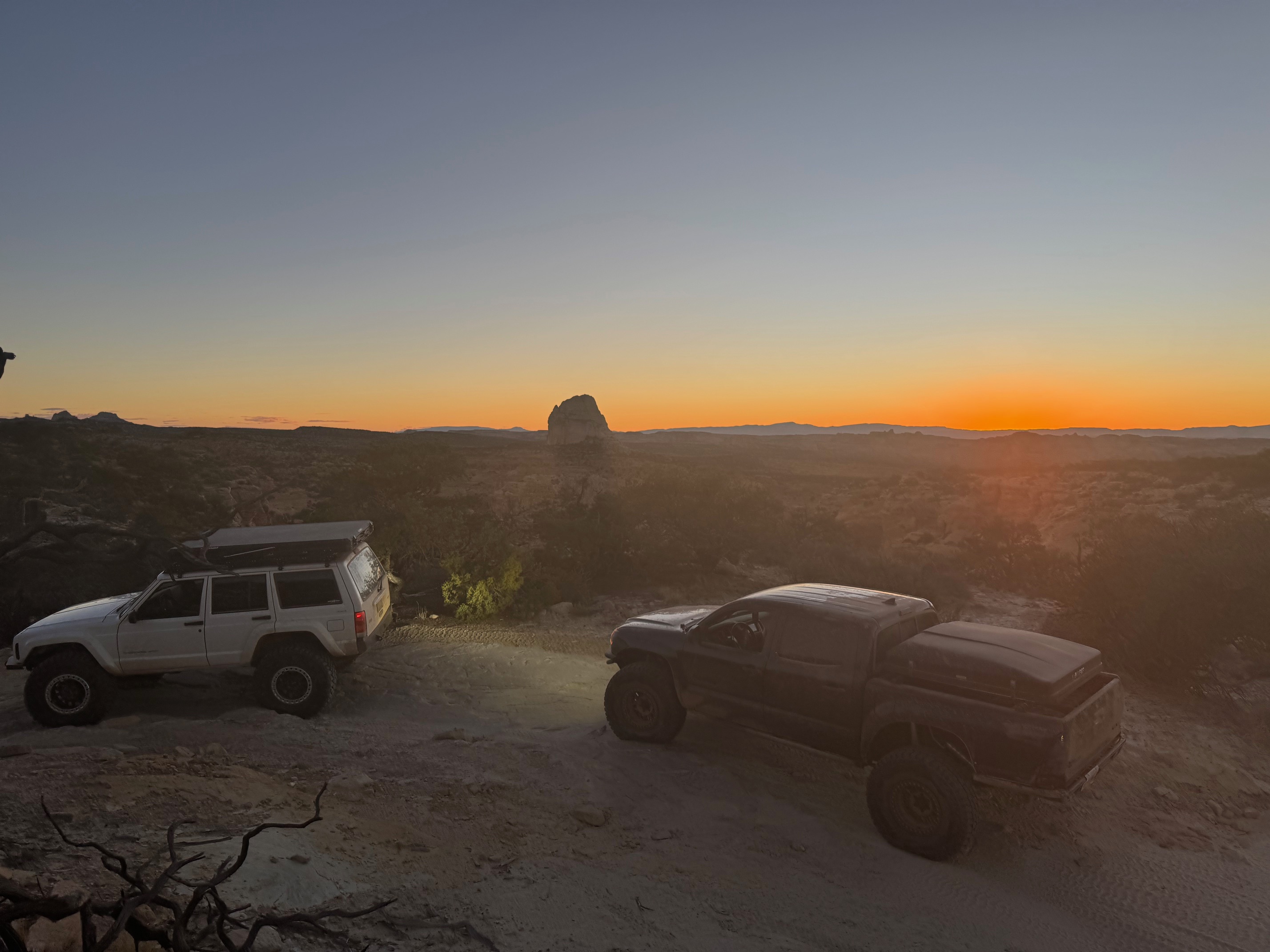 image of an off-road vehicle with lifted suspension and custom wheels