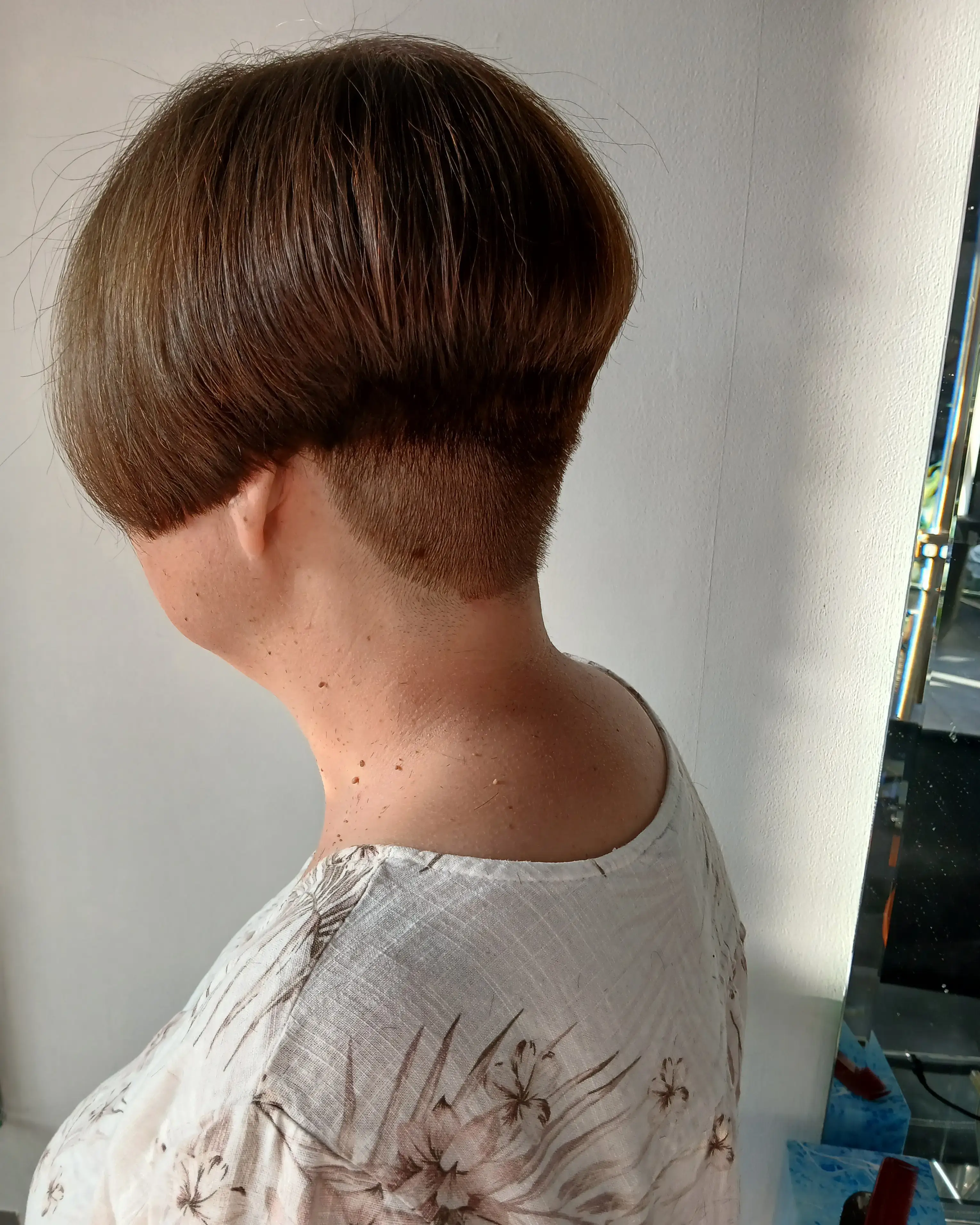 Short bob haircut with clean lines and subtle waves