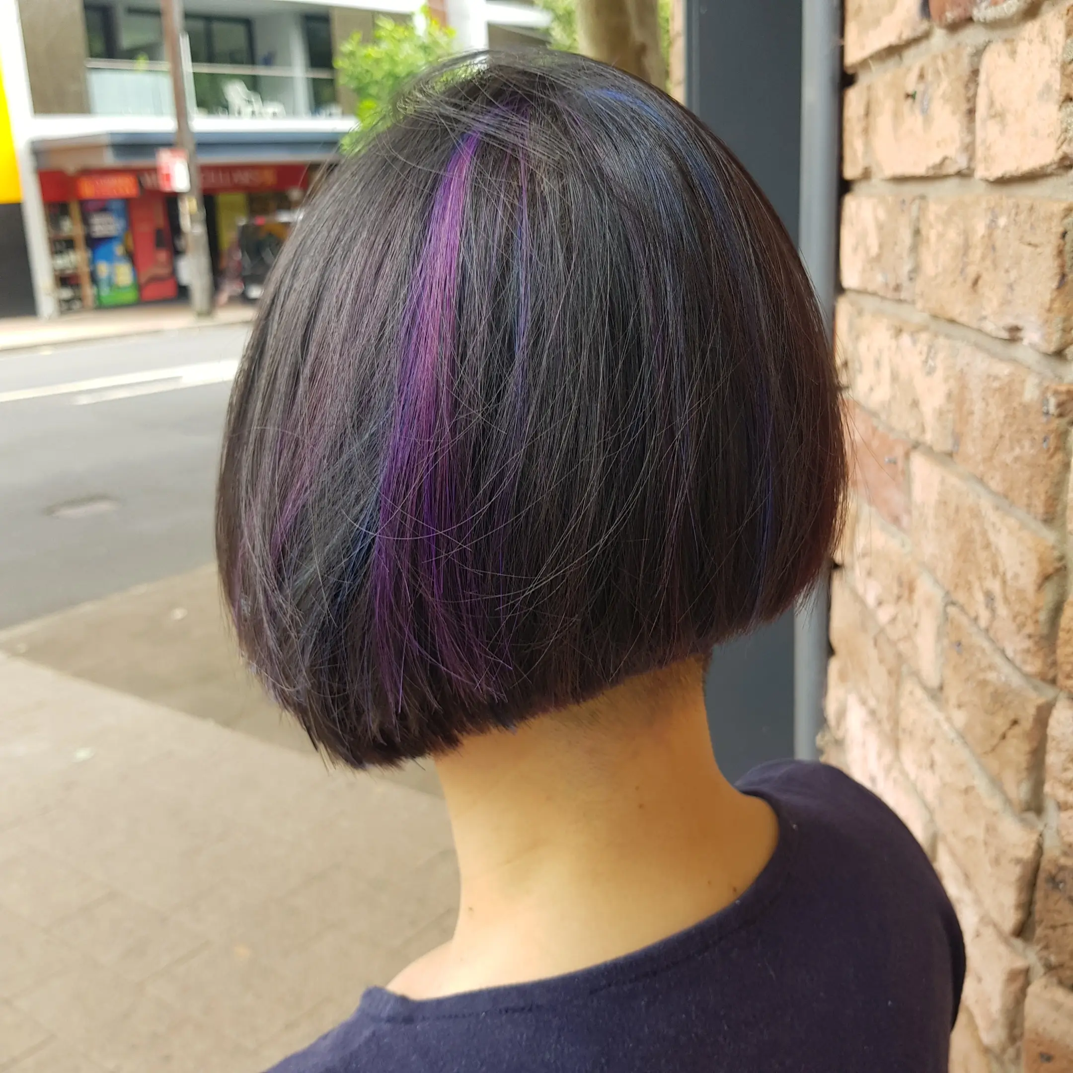 Brunette haircut finish with natural volume and texture