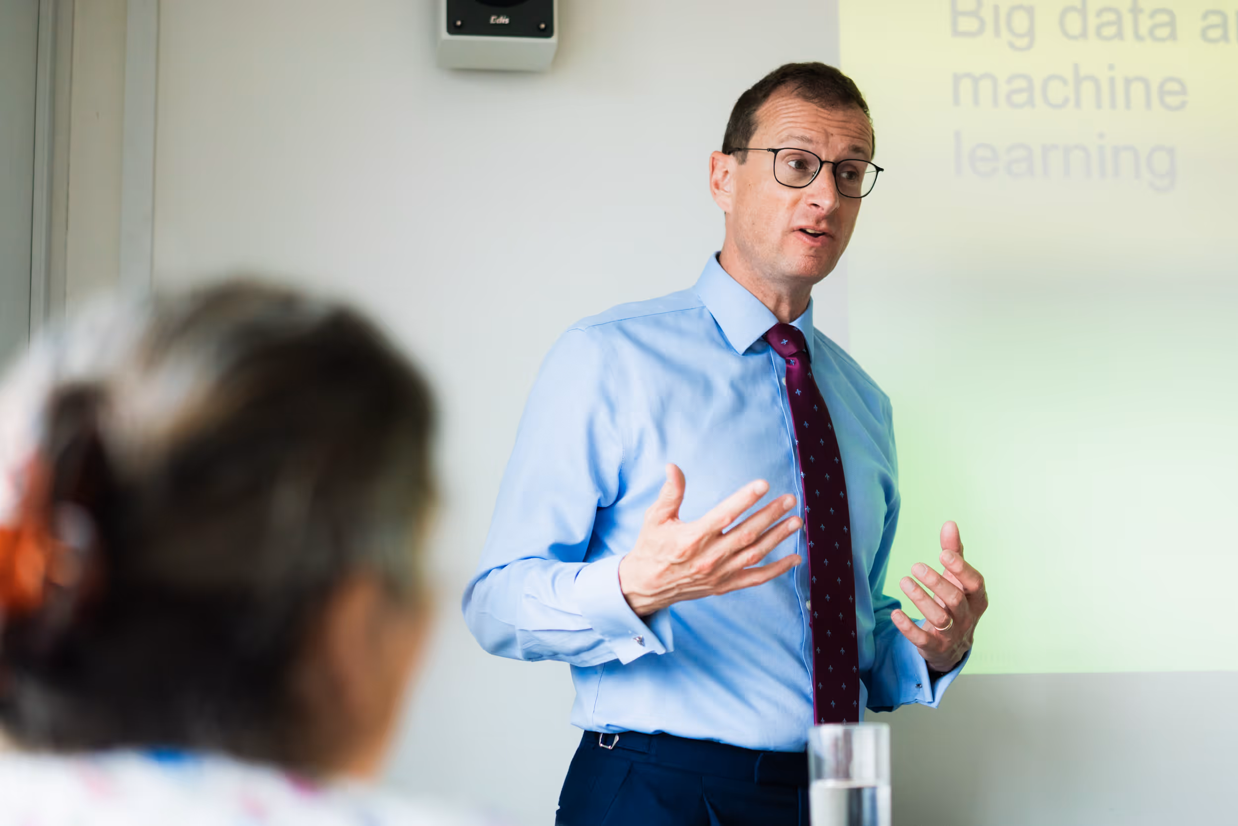 David Culley explaining something to a classroom of people.