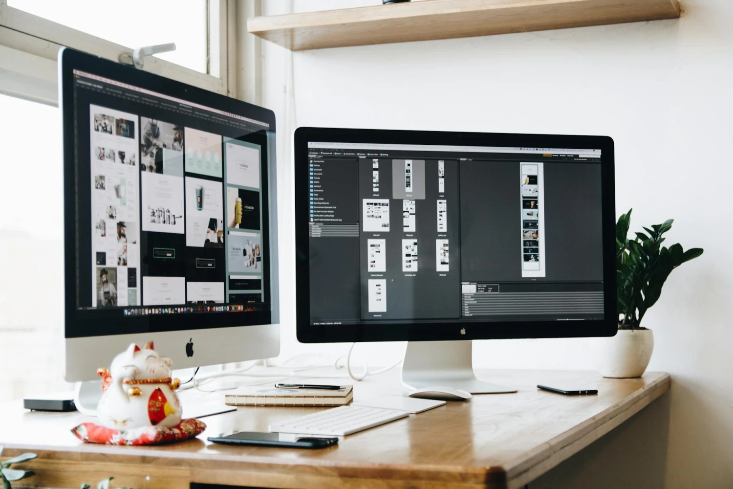 Dual monitor with web development pages open.