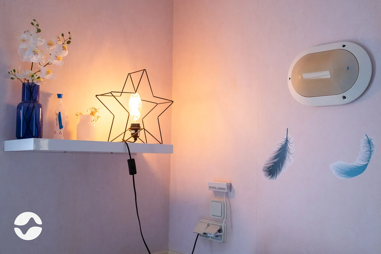 Orikio box connected to the wall of a resident's bedroom.