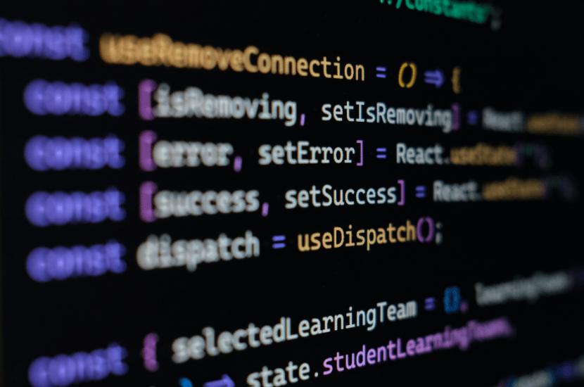 A computer screen displaying lines of code in motion, representing dynamic software development and programming processes.
