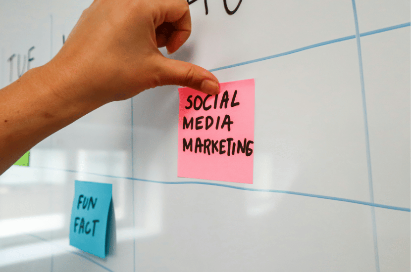 Colorful sticky notes covering a whiteboard with social media marketing strategies, showcasing campaign planning and content ideation for digital solutions.