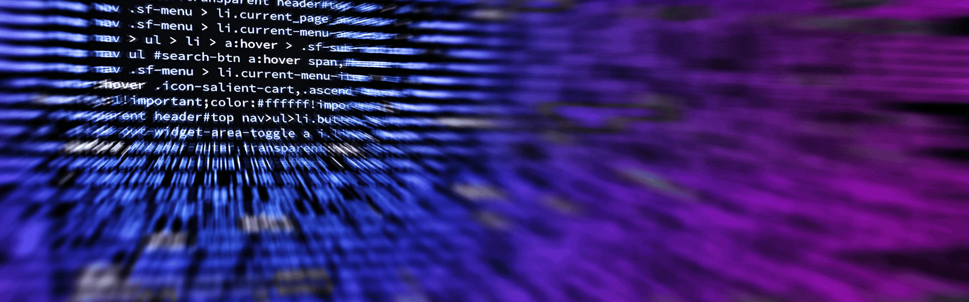 Luminous lines of blue and purple code streaming across a dark background, symbolizing modern software development and digital innovation.