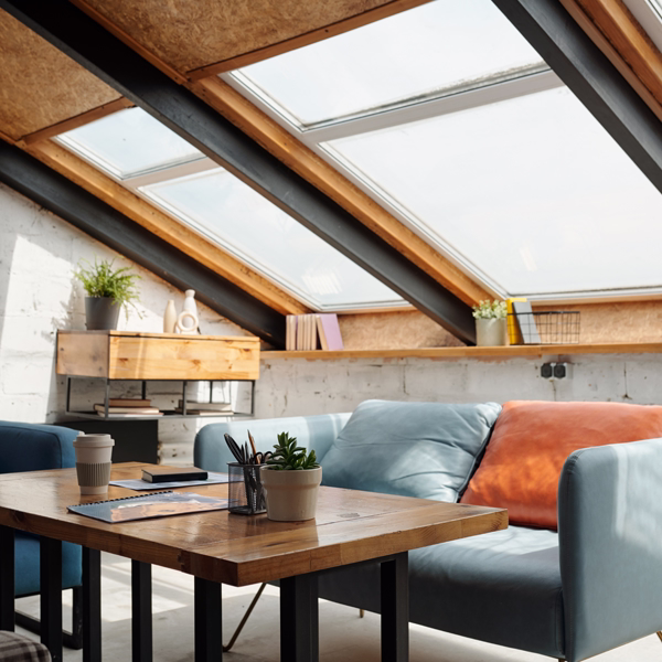 Modern living room with large skylight windows providing bright natural light.
