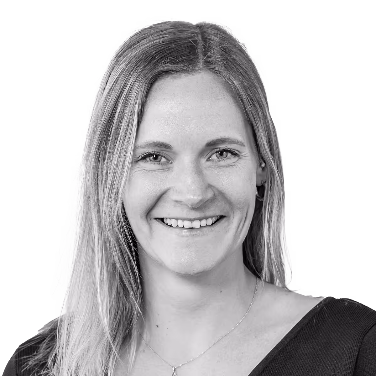 Smiling woman with long hair in black top, black and white portrait
