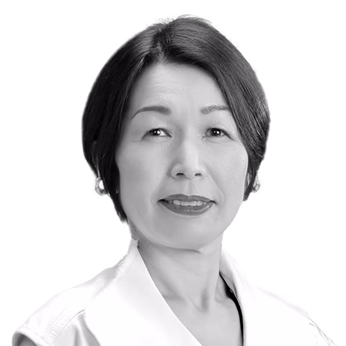 Professional woman in white coat smiling in black and white headshot