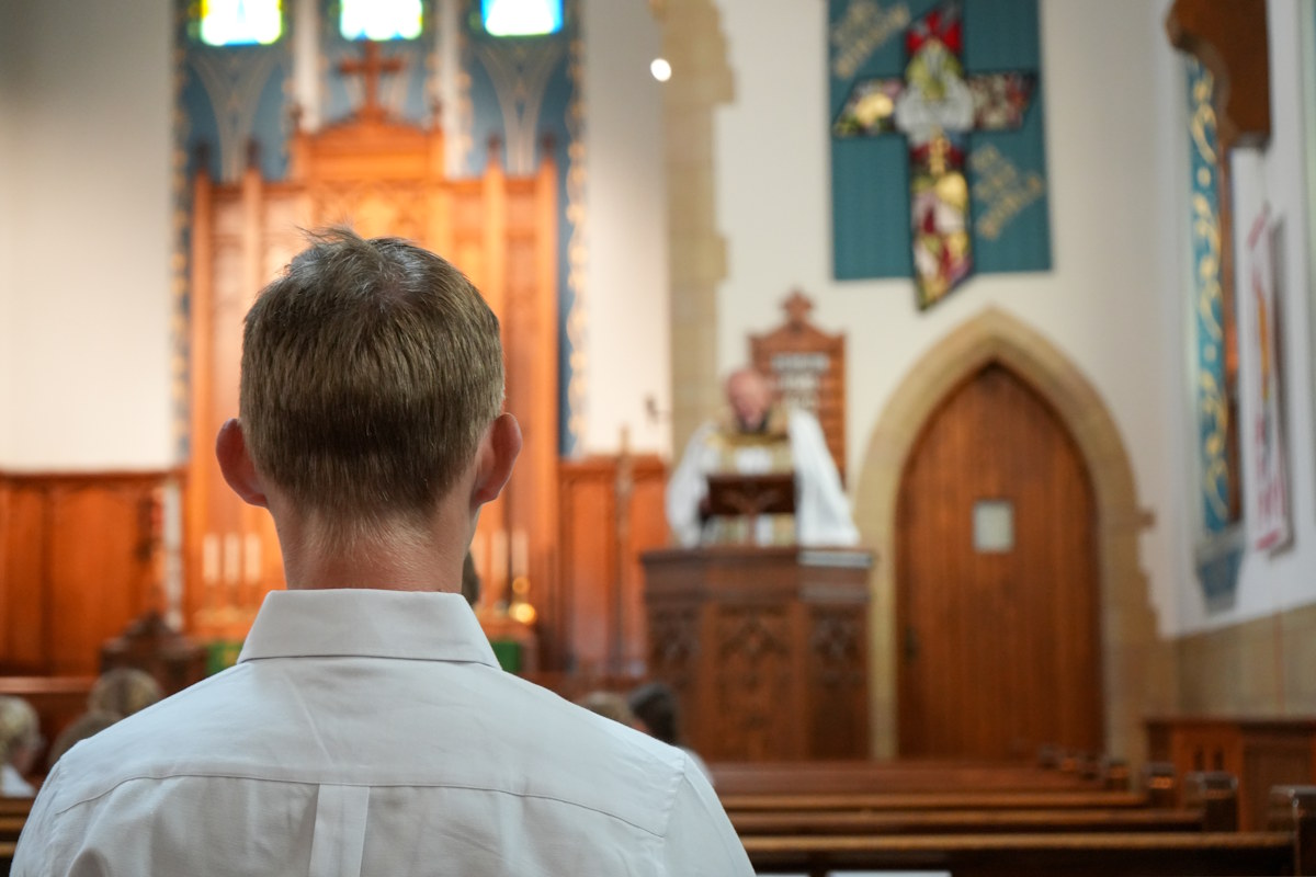 teenage student in chapel service