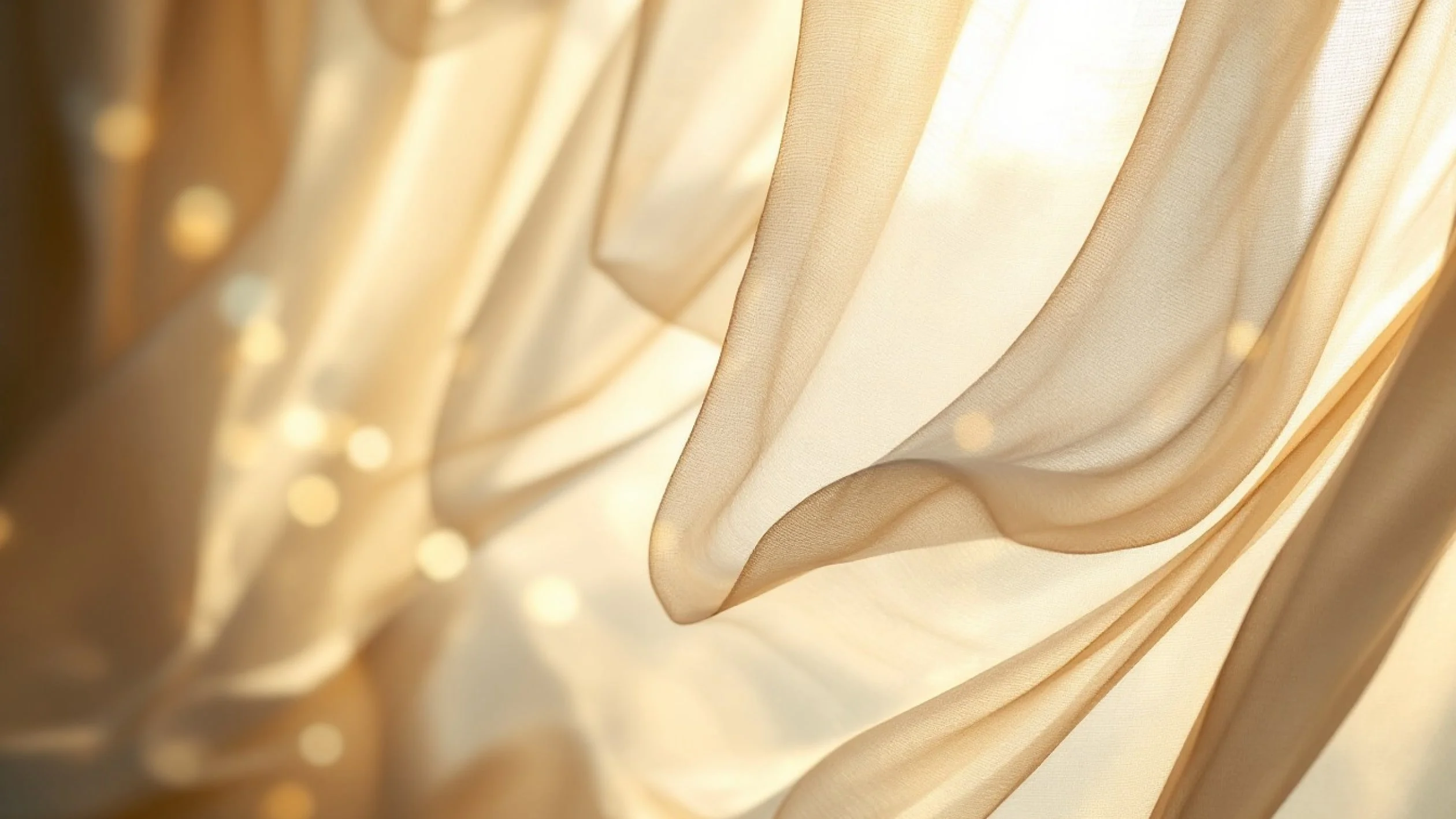 Soft beige curtains with sheer, flowing fabric gently draped and backlit by warm sunlight, creating a dreamy and ethereal effect with glowing light spots in the background.