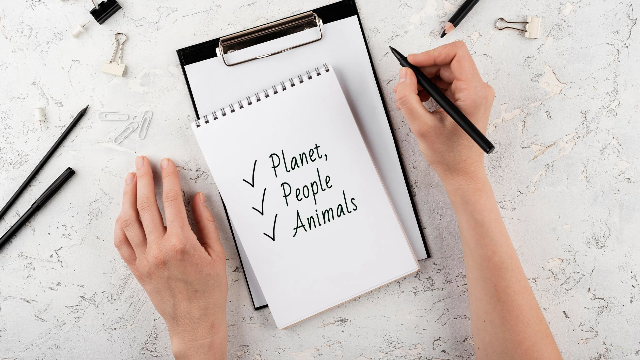 A patient interacts with people and animals while reviewing a checklist in a clinical setting.