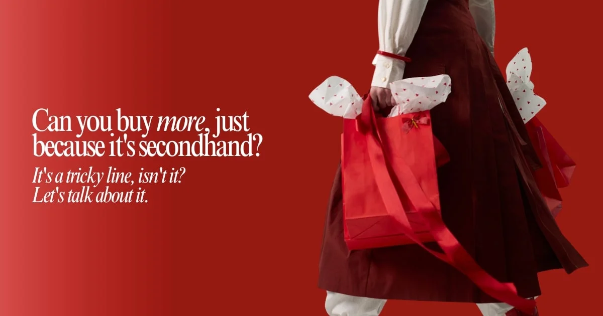 A woman in a red dress holds a matching red bag, standing confidently against a neutral background.