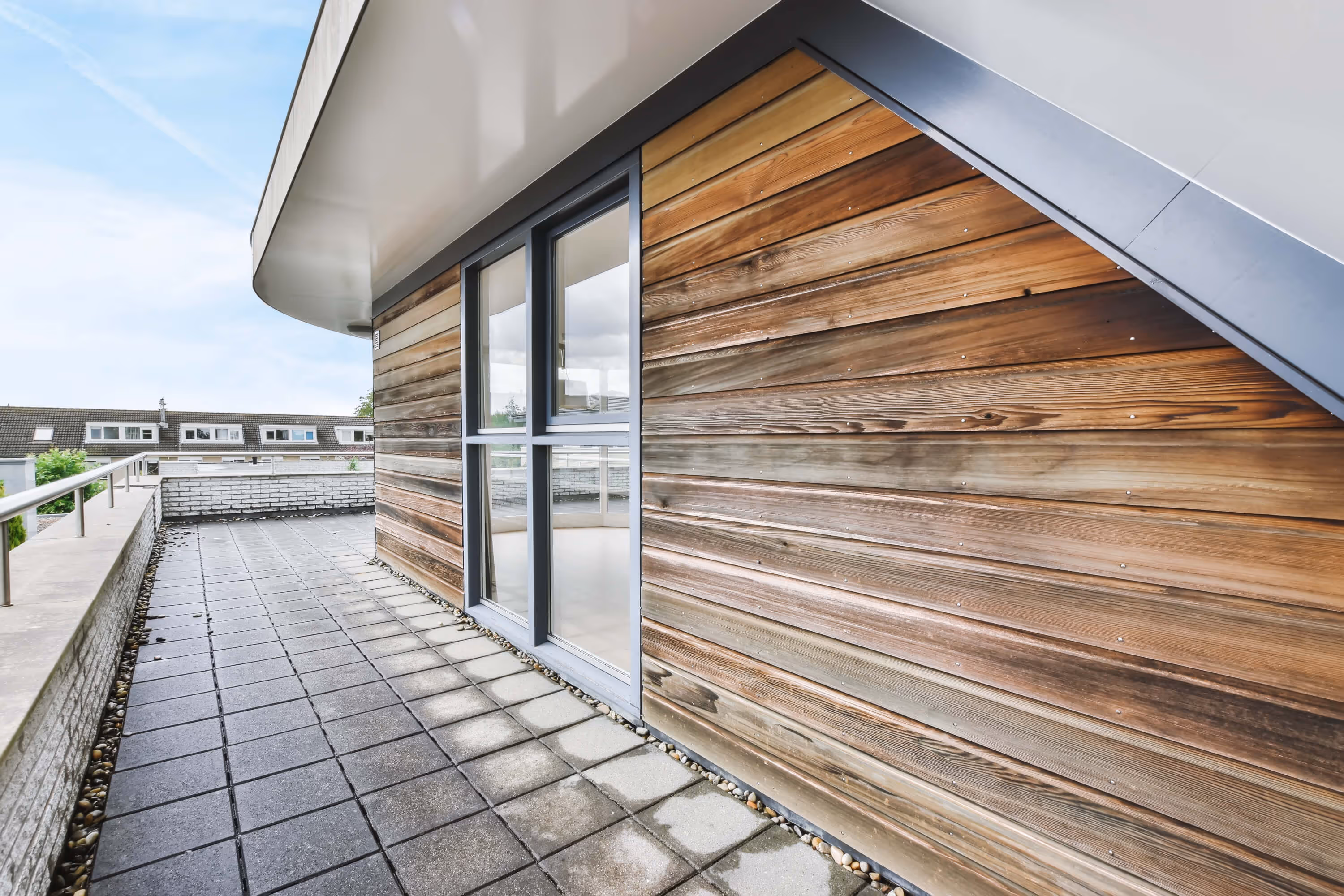 Modern house exterior featuring high-pressure laminate (HPL) panels