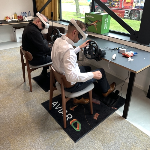 Photo from the training. Two people in a VR headset perform training tasks