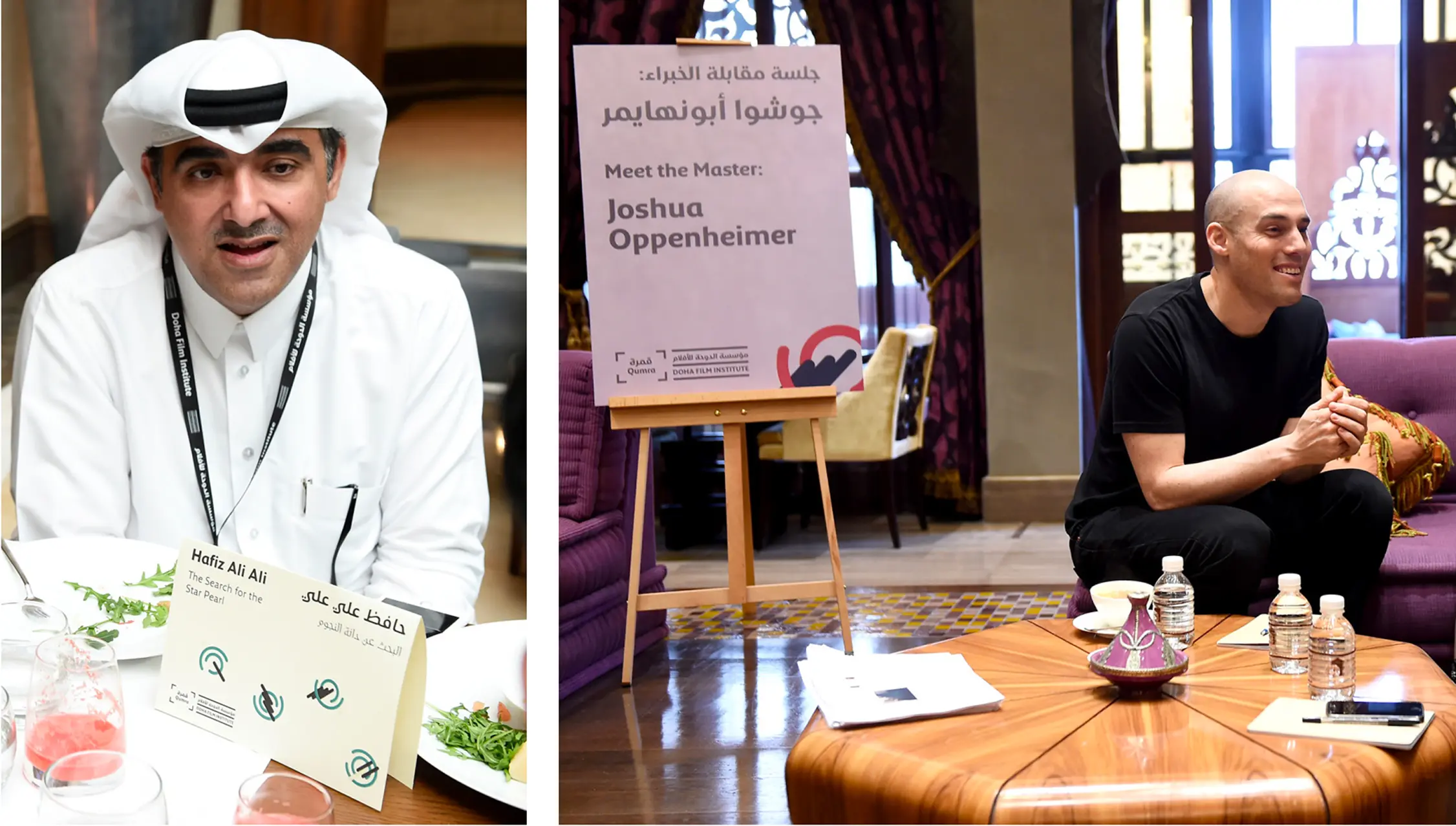 Two men in an indoor setting; one in traditional white attire with a name card reading Hafiz Ali Ali, the other smiling and seated on a purple couch near a signboard that reads 'Meet the Master: Joshua Oppenheimer.'