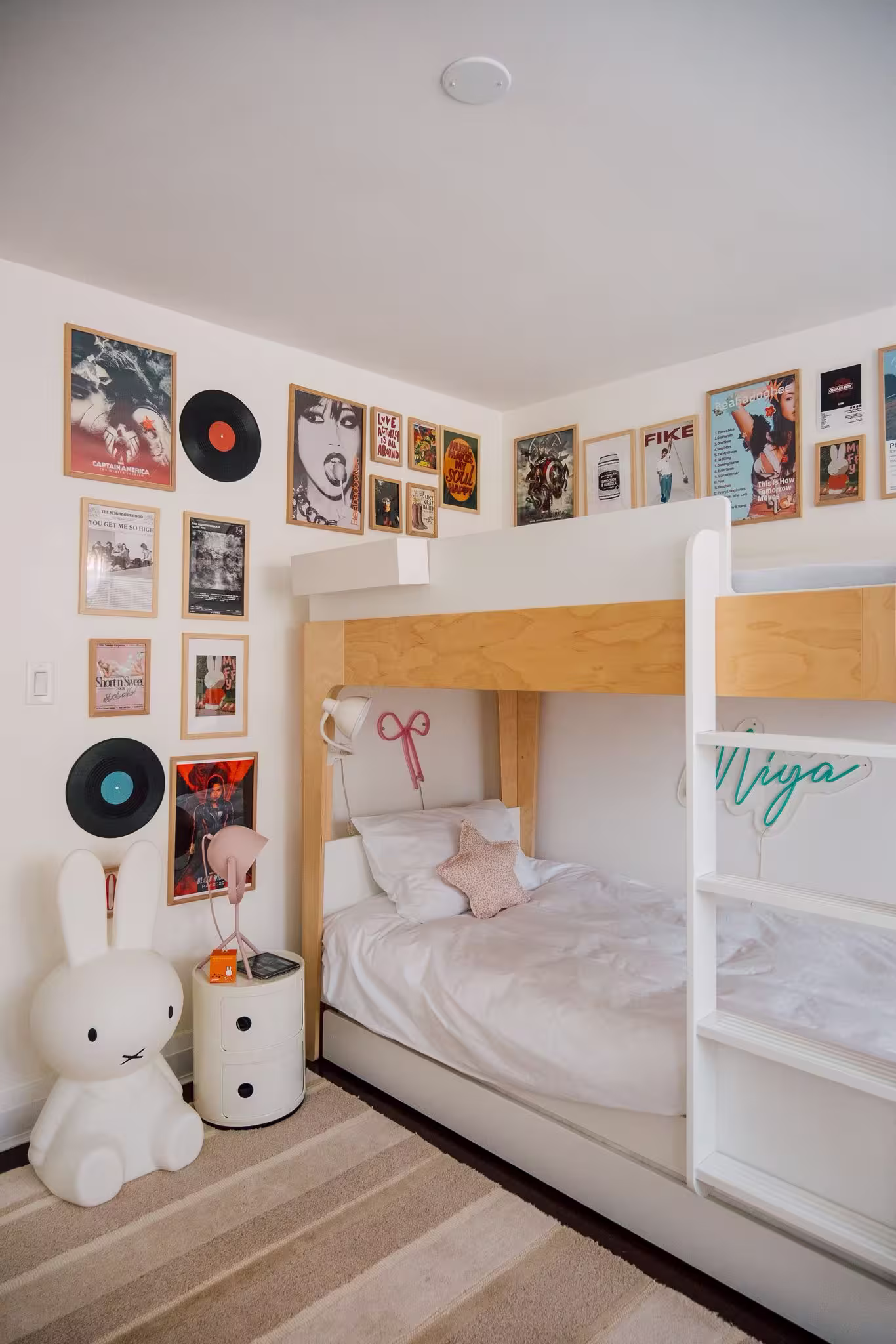 Completed teenage bedroom with soft neutral tones, modern desk setup and wall art designed remotely by Roberts Renovations for overseas clients