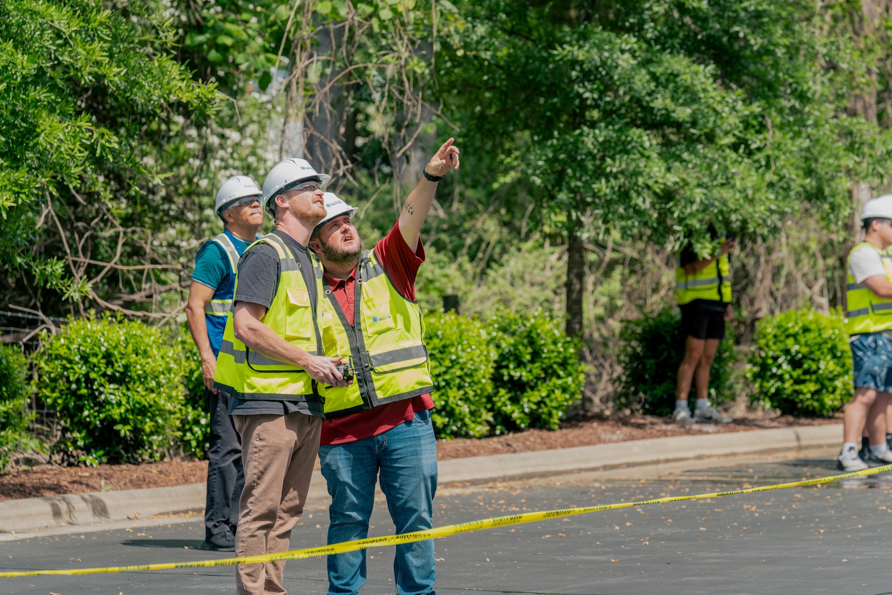 Professional drone cleaning operator reviewing an area and safety checklist before a commercial exterior cleaning job