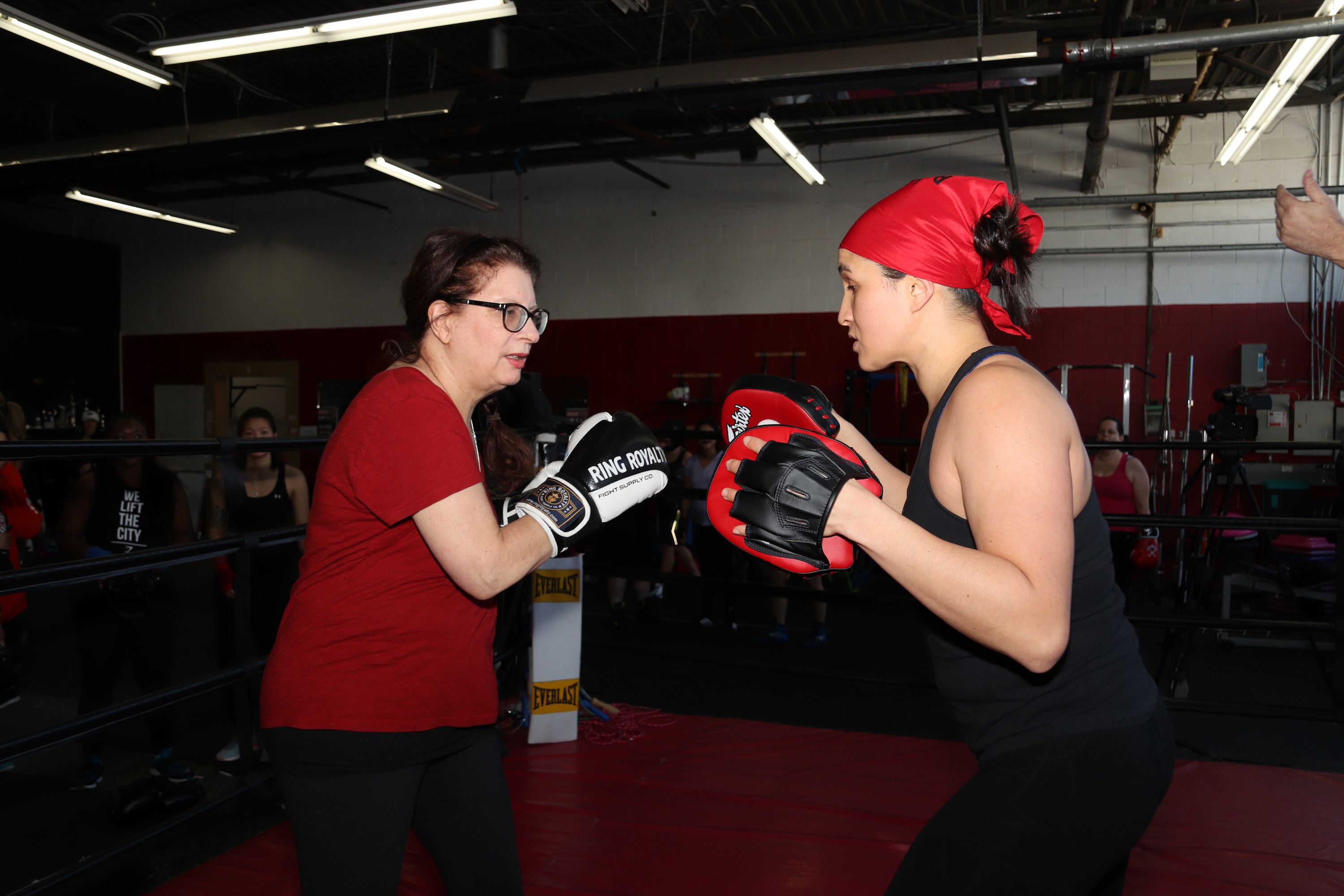 lita demonstrating boxing moves for a client