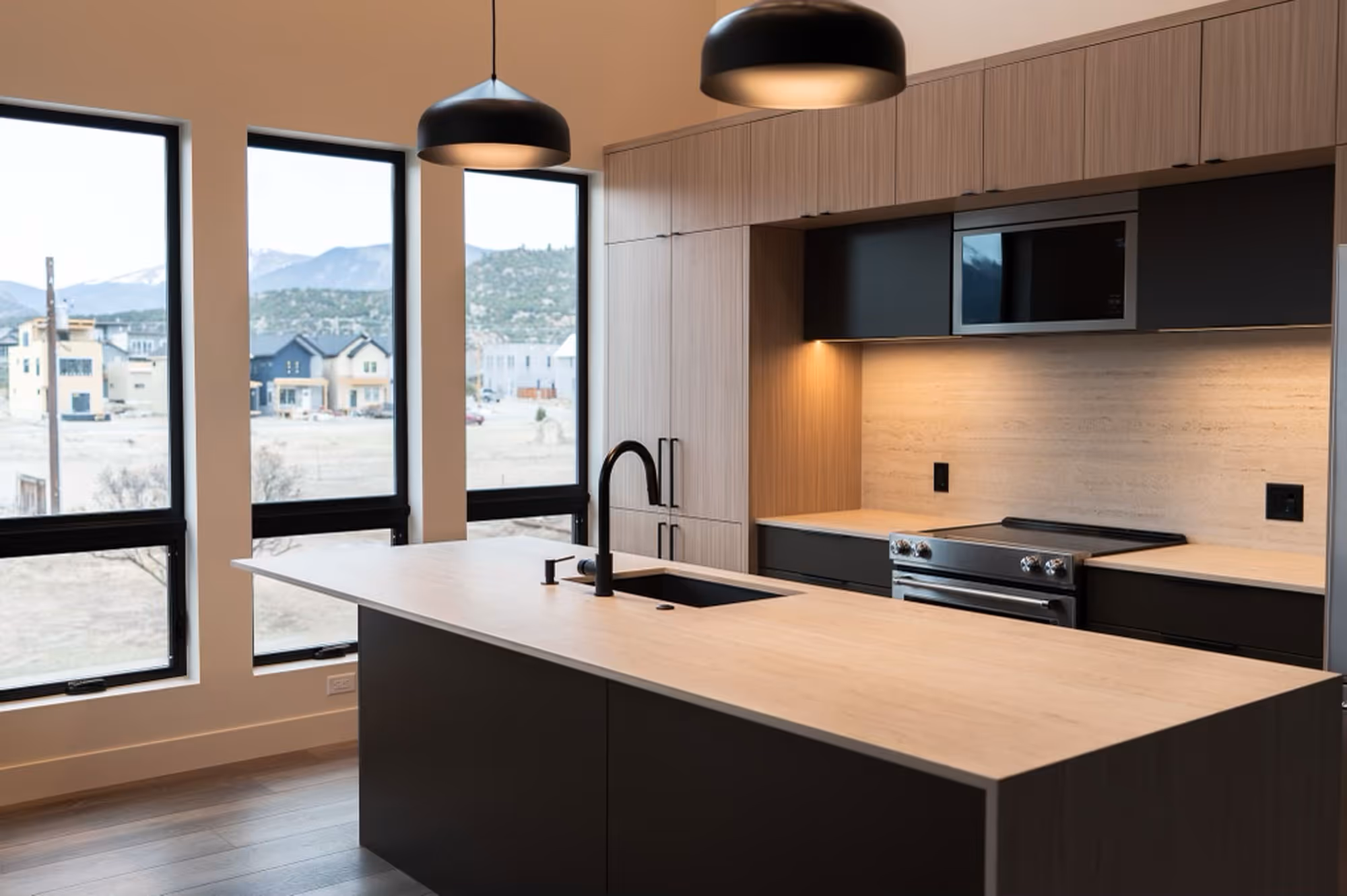 Image of a newly built, modern kitchen with mountain views out of the windows