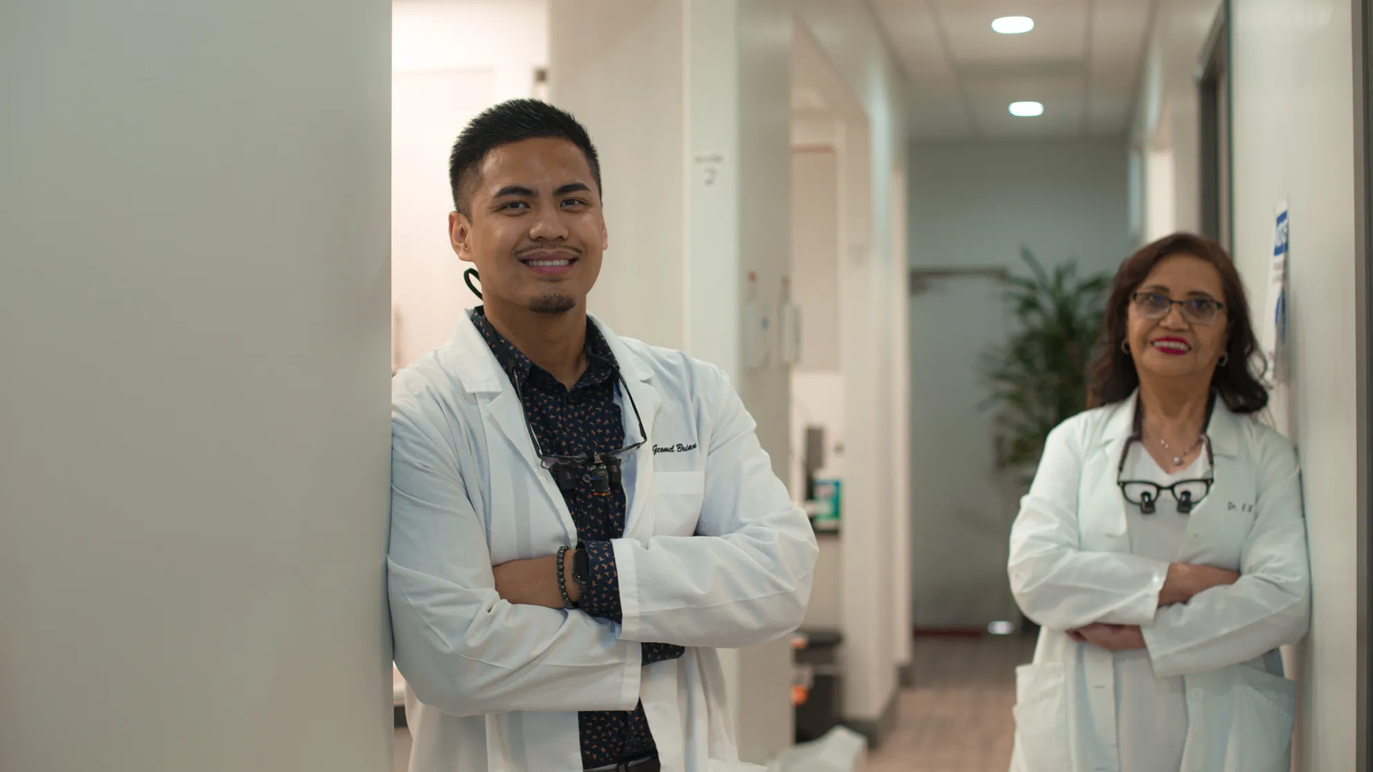 male doctor standing in a hallway with a female doctor Dynamic Dental