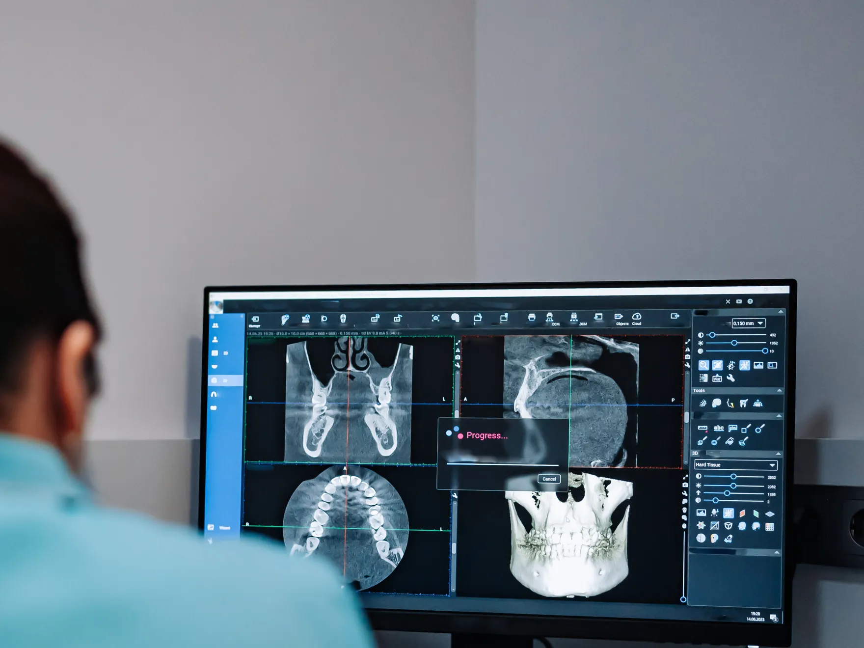 image of a man looking at a computer screen with a skull on it Dynamic Dental