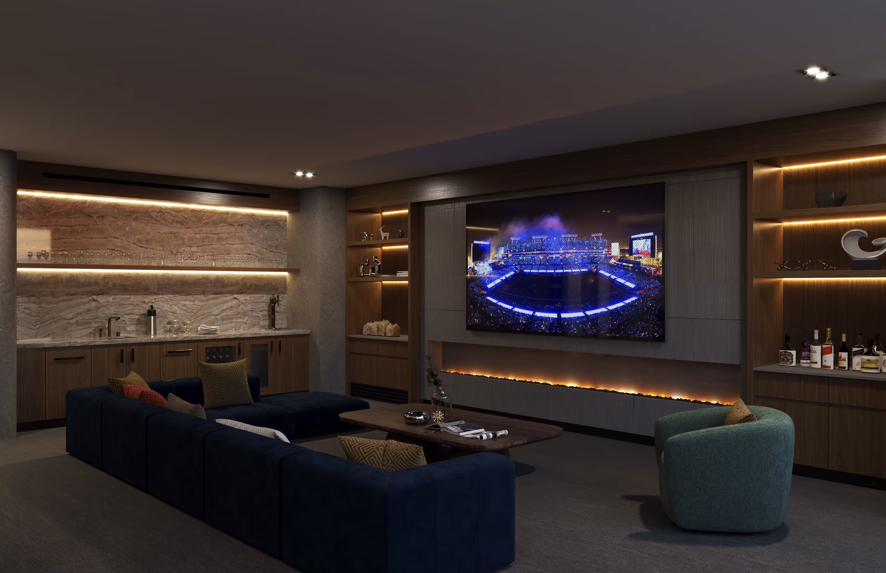 Resident entertainment lounge with a large sectional sofa, fireplace, full bar area, and a large TV for viewing events at The Astrie in Tucson, AZ.