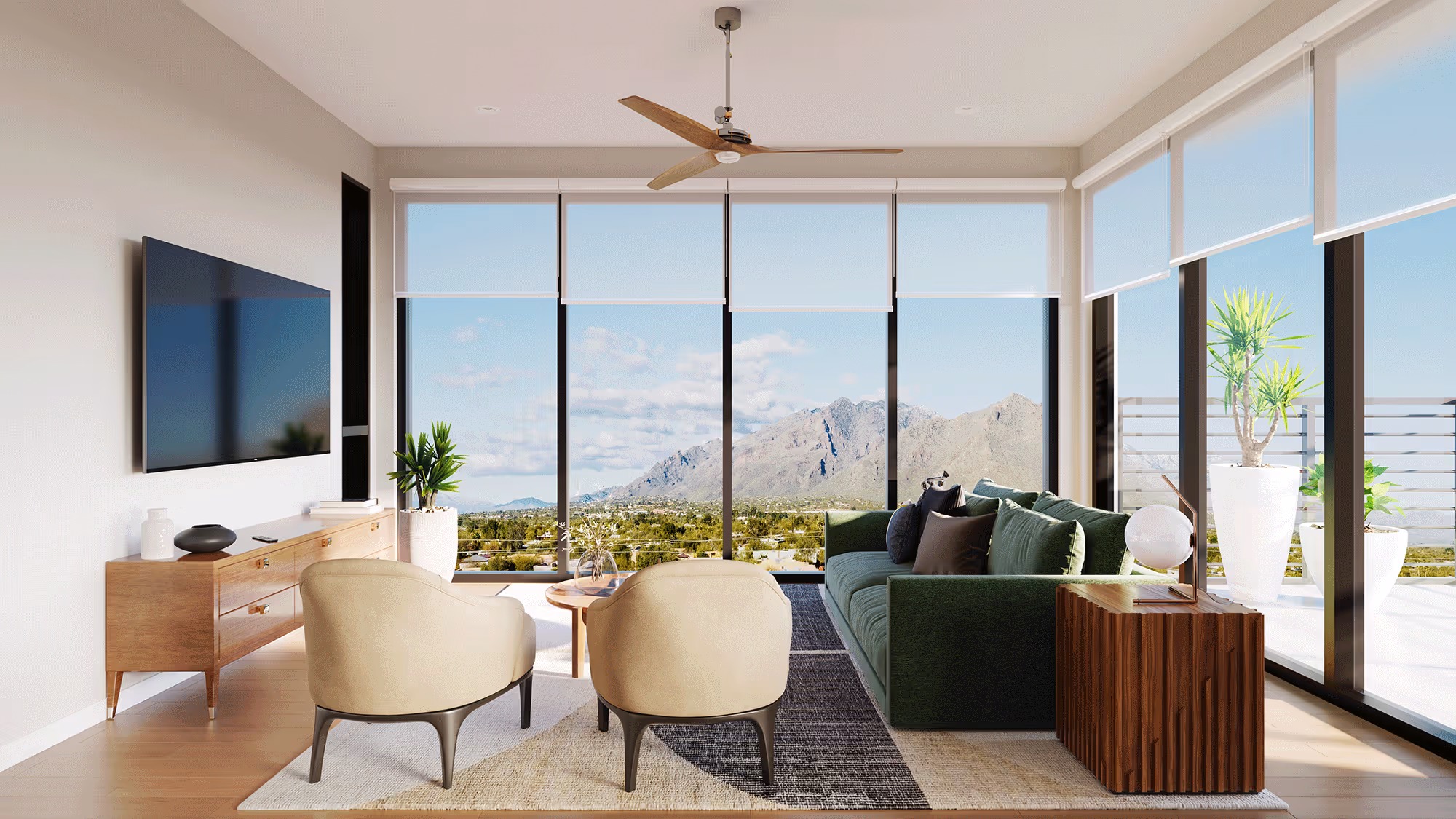 Luxurious apartment living room with a green velvet sofa and floor-to-ceiling windows offering panoramic mountain views at The Astrie in Tucson, AZ.