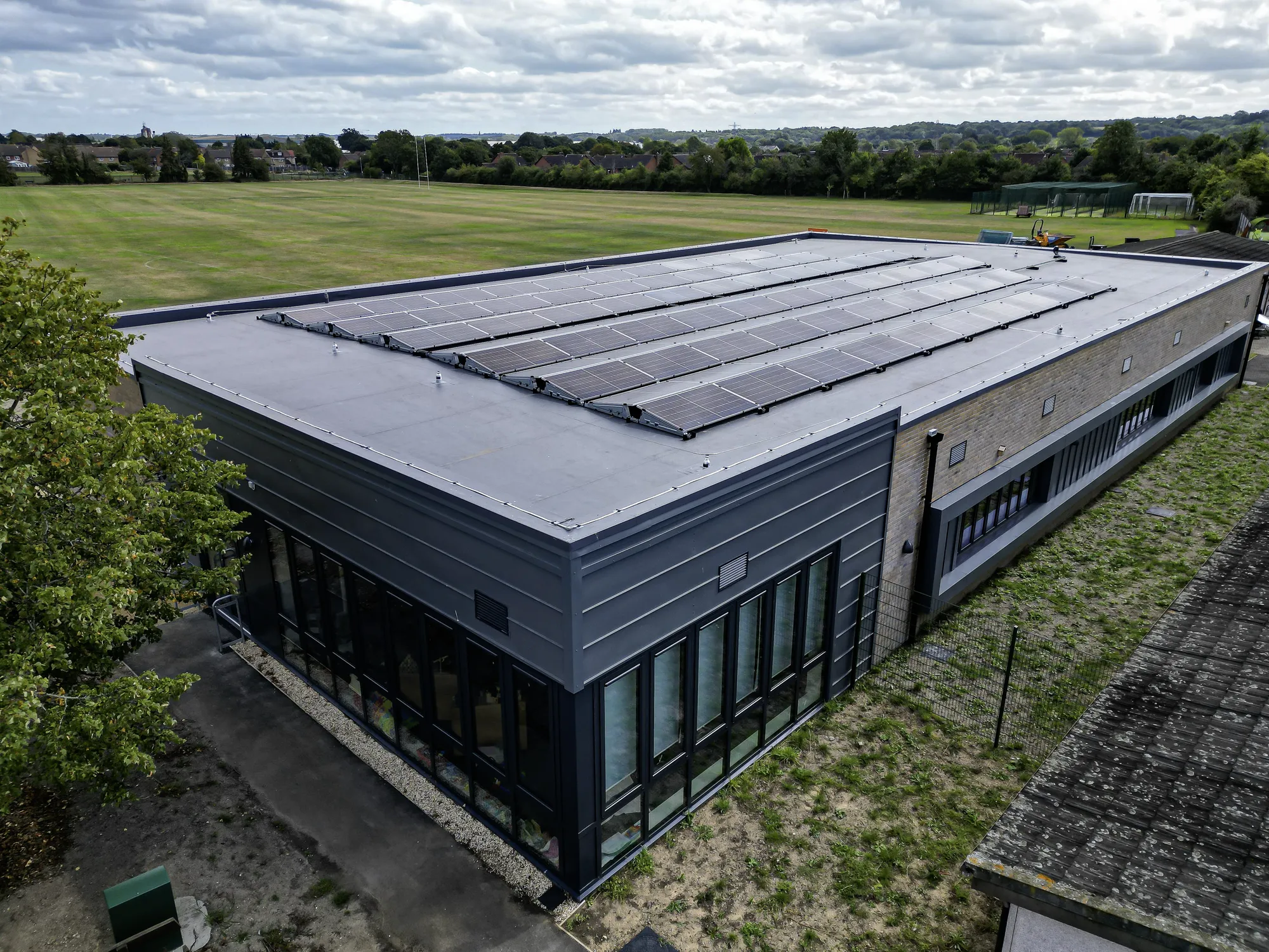 Kennet School, Thatcham: aerial view of the single storey replacement teaching block with roof mounted solar panels