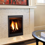Enviro Small Fireplace Insert Q1 with clean face design, flames visible, installed in a modern living room setting, highlighting heating solution features.