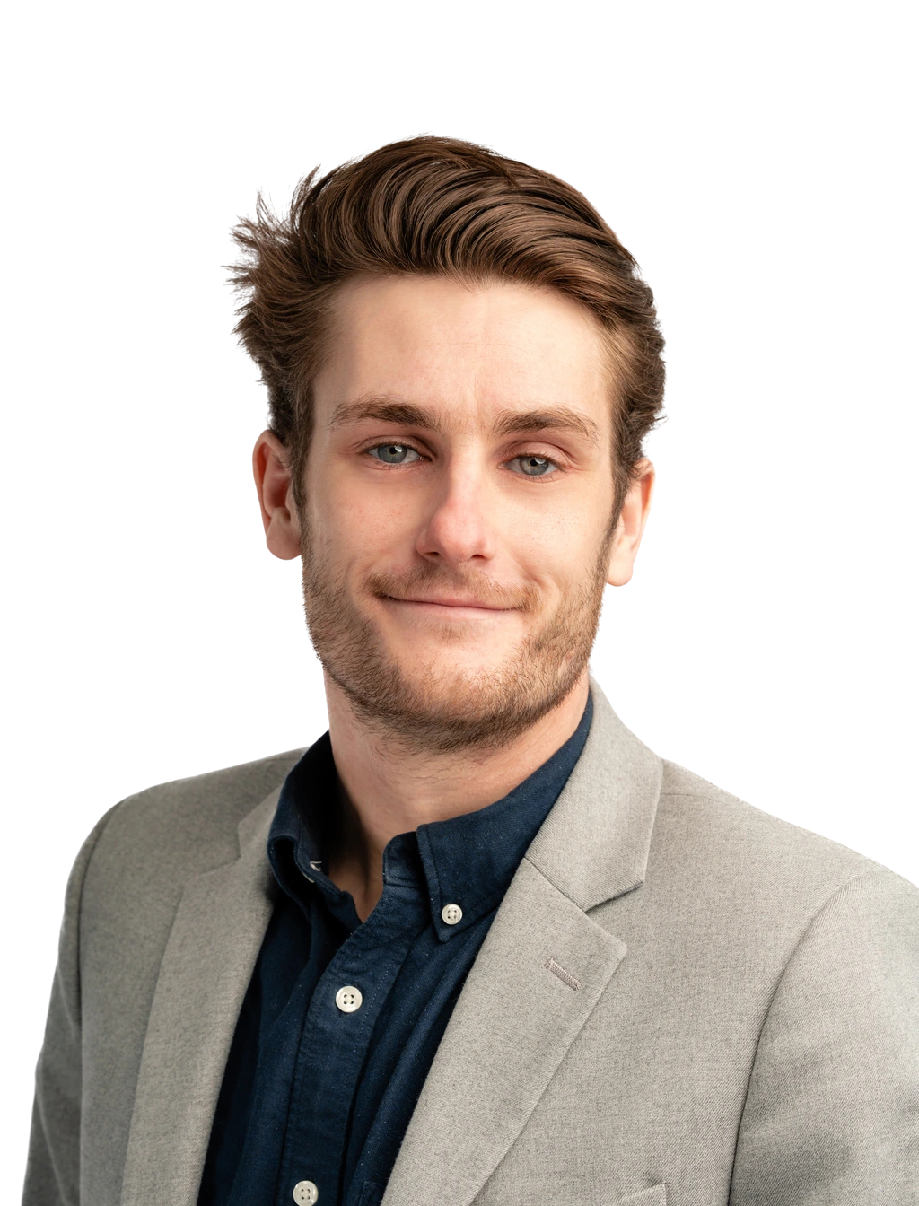 Professional headshot of a team member wearing business attire, smiling confidently against a plain white background.