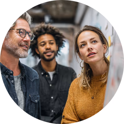 Team discussing strategy at white board