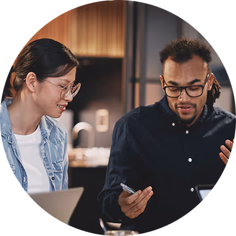 Coworkers brainstorming ideas on a computer