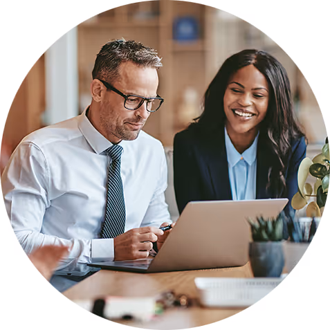 Man and woman looking at laptop