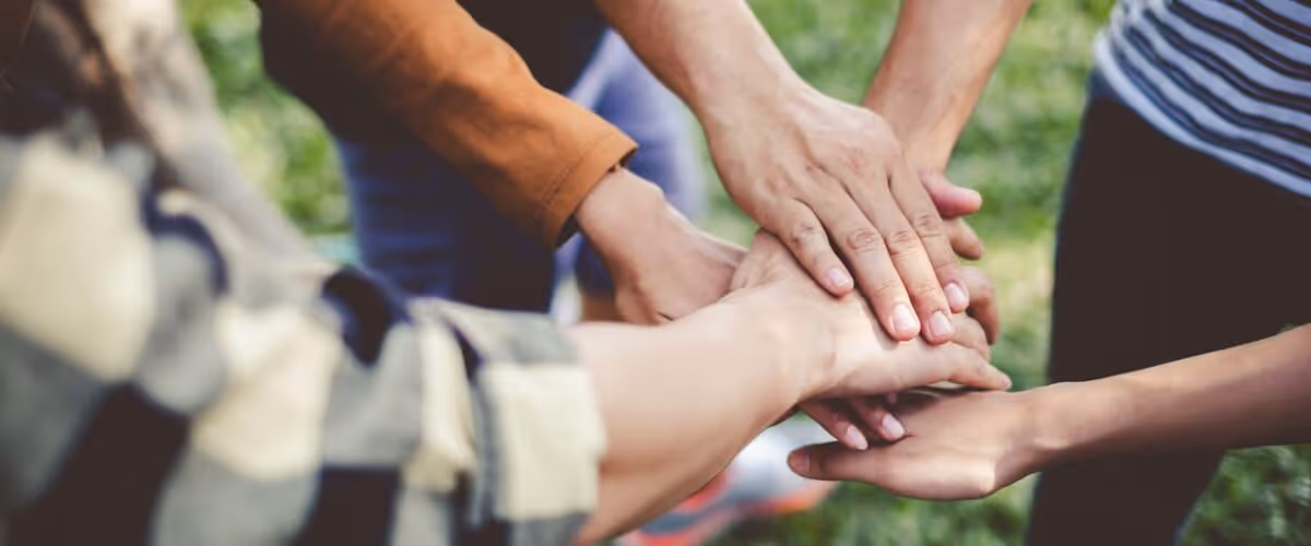 stacking-hands-of-young-teen-student-teamwork-togetherness-and-picture-id985577158