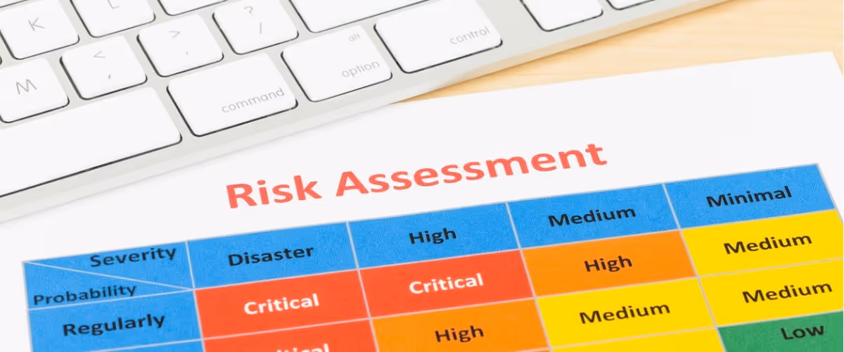 risk-management-matrix-chart-with-pen-and-keyboard-picture-id1032041794