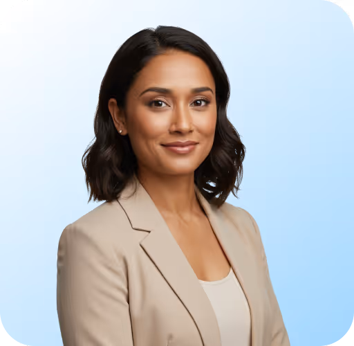 Confident woman with shoulder-length dark hair wearing a beige blazer on a light blue background.
