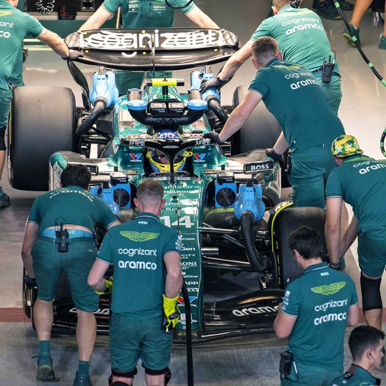 Formula 1 Aston Martin pit crew working on race car during pit stop