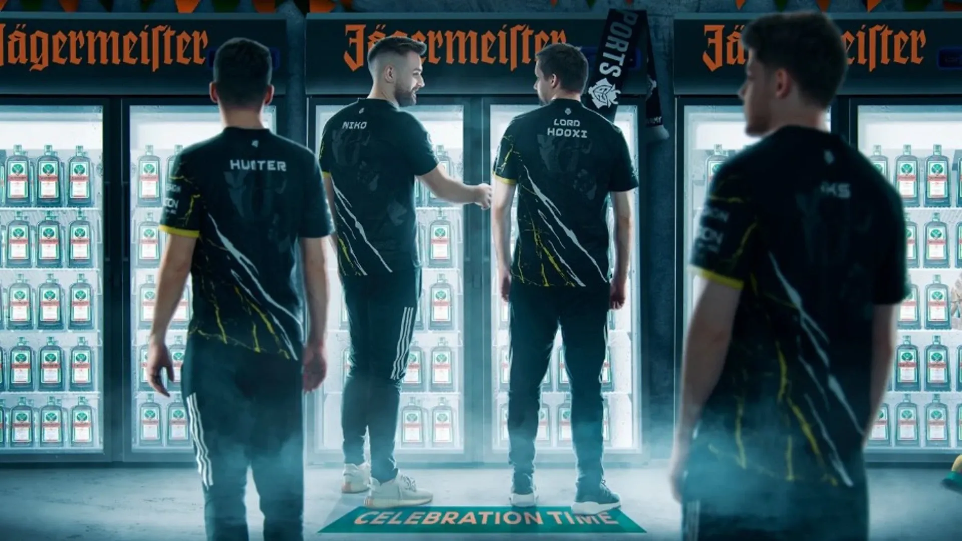 G2 Esports players stand in front of Jägermeister fridges in a branded partnership scene with 'Celebration Time' displayed on the floor.
