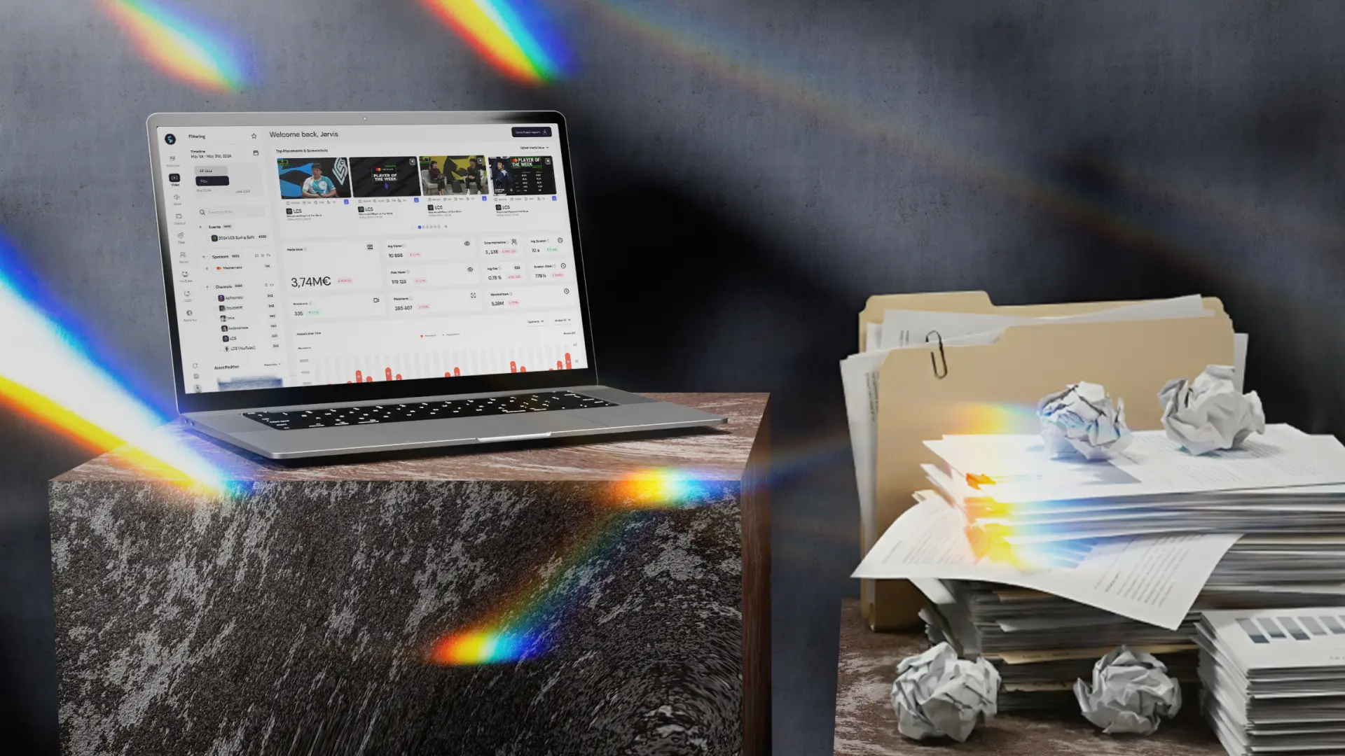 A laptop displaying an analytics dashboard sits on a stone surface, casting colourful light reflections, while a messy stack of paper reports and folders sits beside it — contrasting modern esports sponsorship analytics with outdated manual reporting.