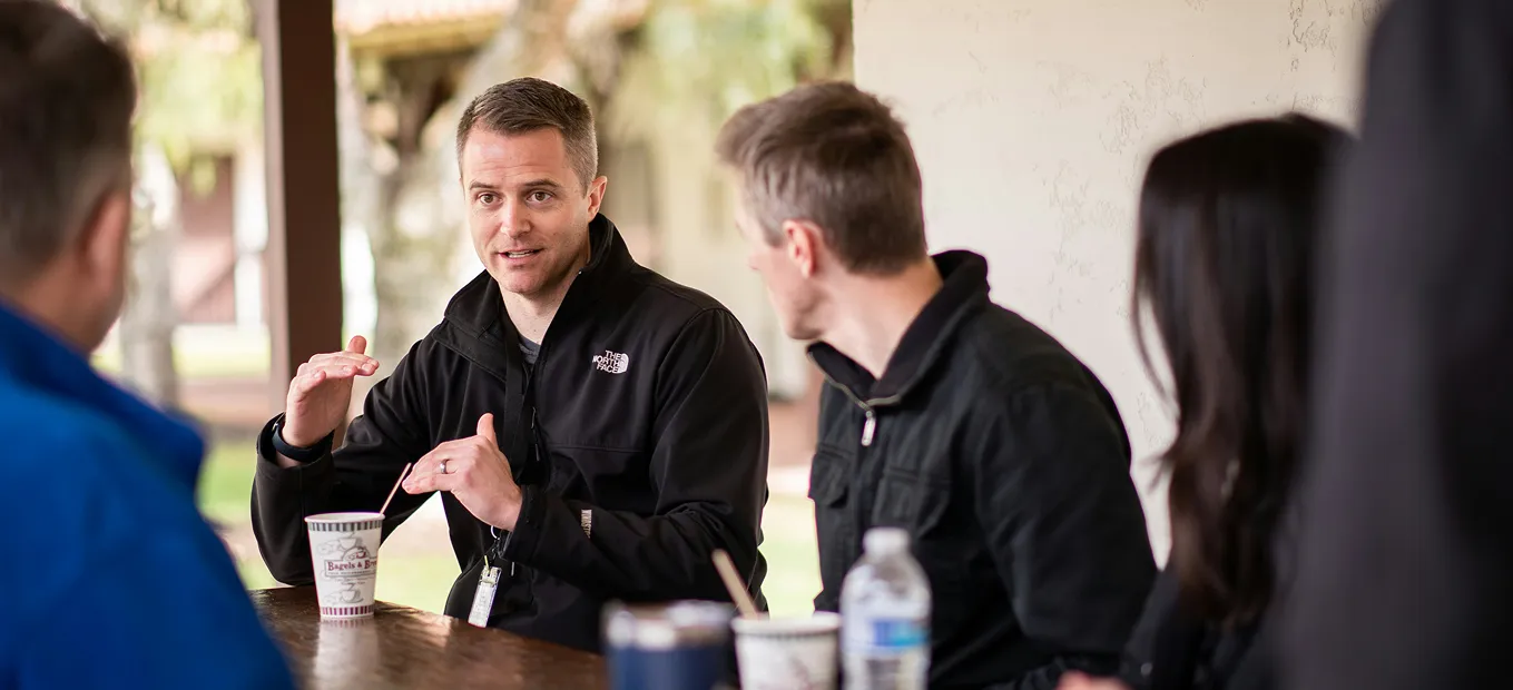 Men discussing things in an office meeting room