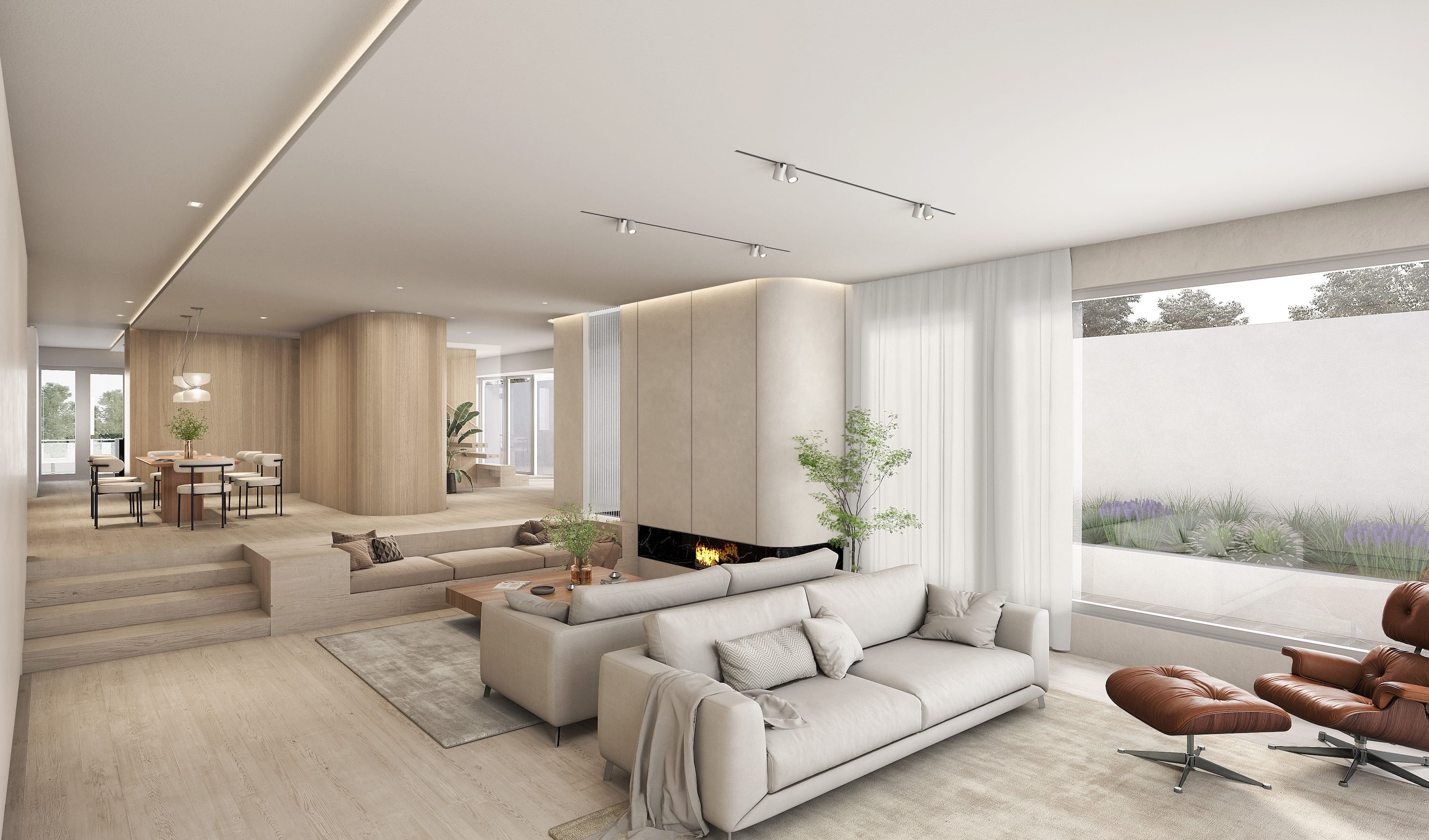 Open-concept living and dining room with sunken seating, modern furniture, and light wood finishes.