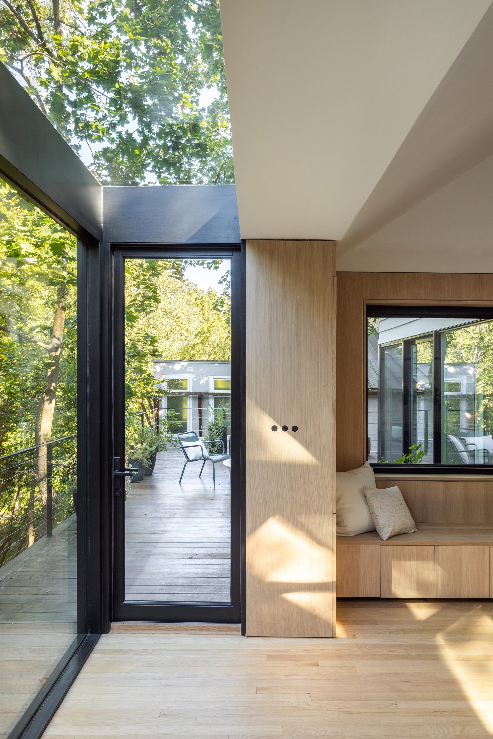 Corner seating area with floor-to-ceiling windows.