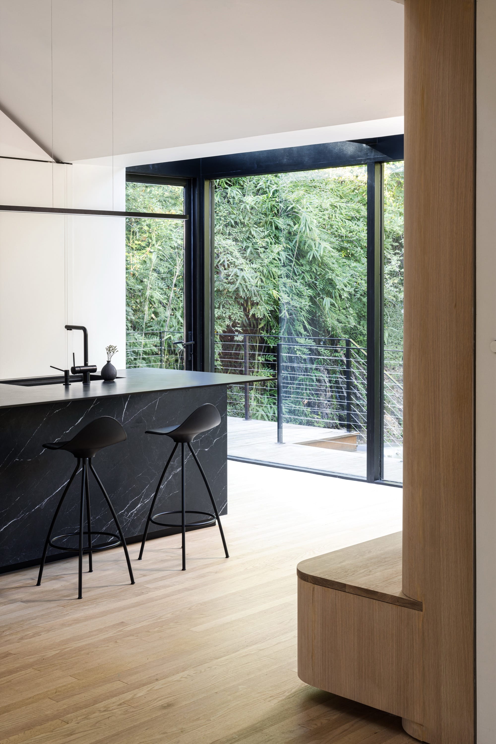 Kitchen with island and glass doors to patio.