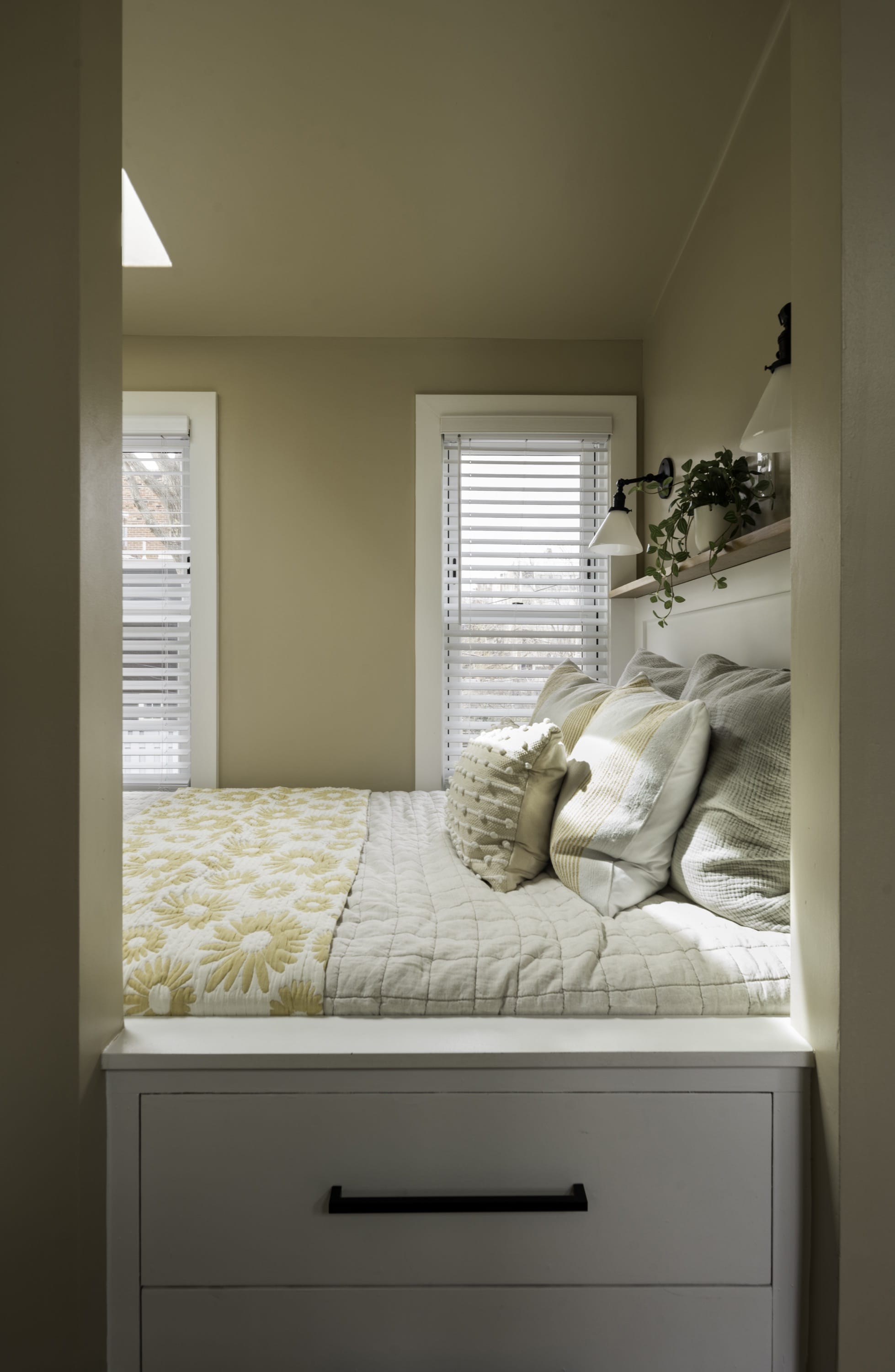 Bedroom nook with soft lighting and neutral tones.
