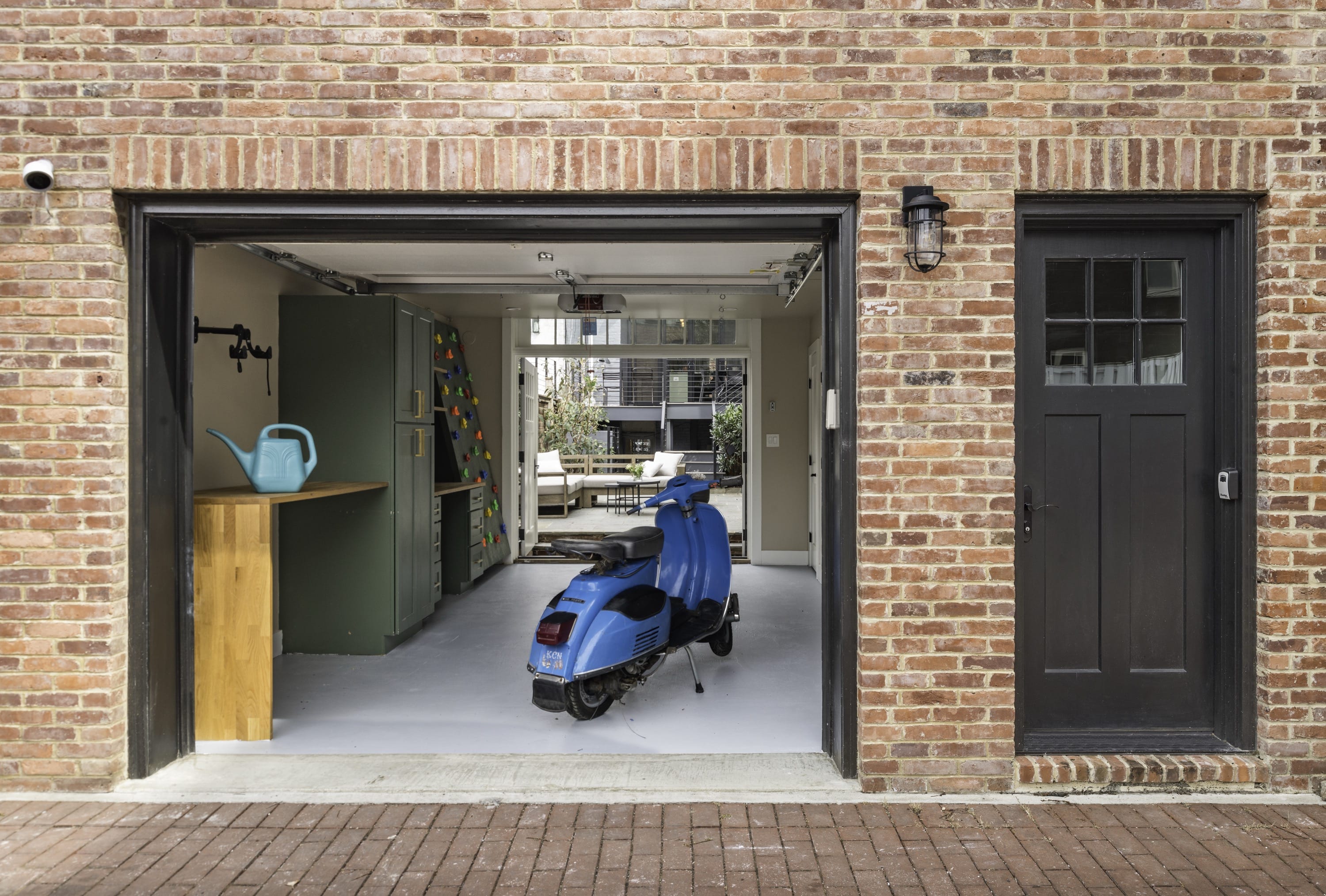 Stairwell with arched window and skylight above.