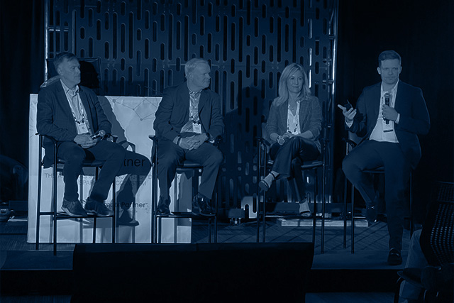 CEO Reis Barrie speaking at a conference.
