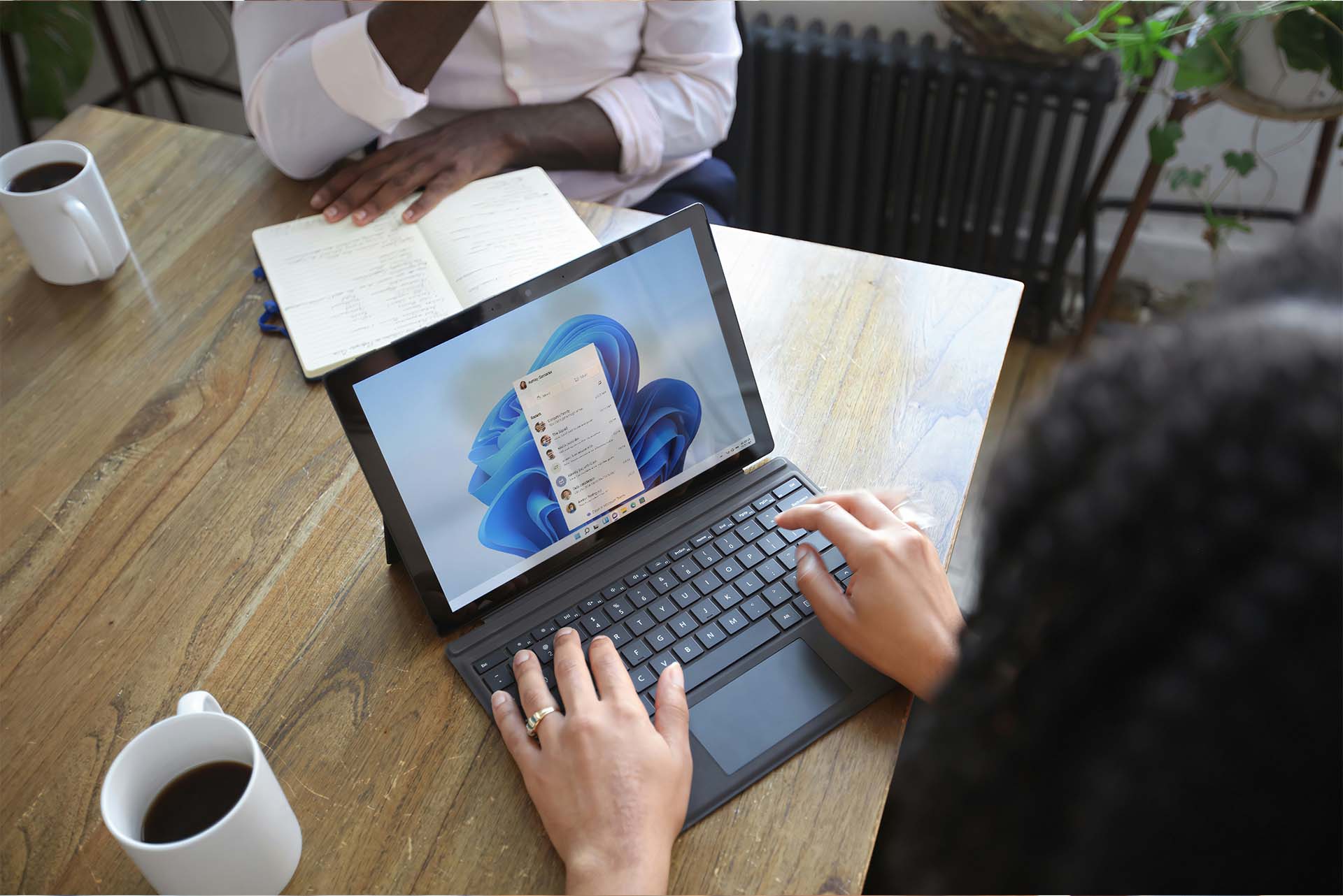 Image of person on computer navigating Microsoft programs.
