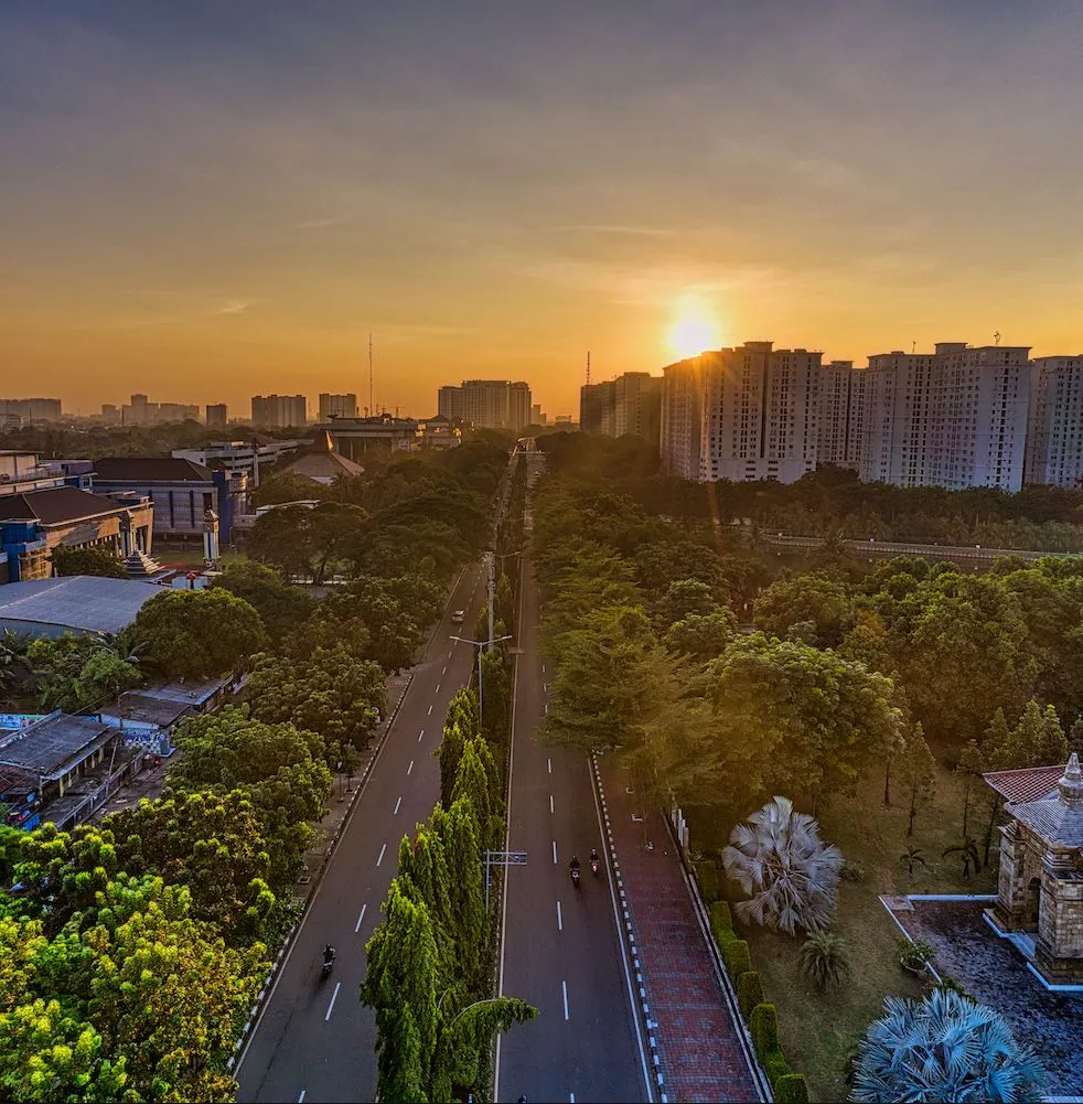 Image of a sunset over a road in Indonesia