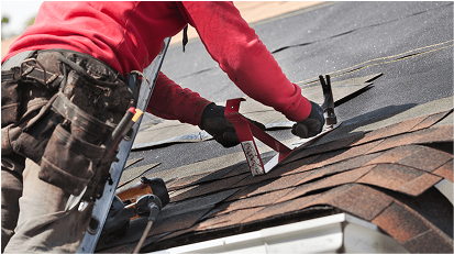 Close-up image of a worker repairing the roof